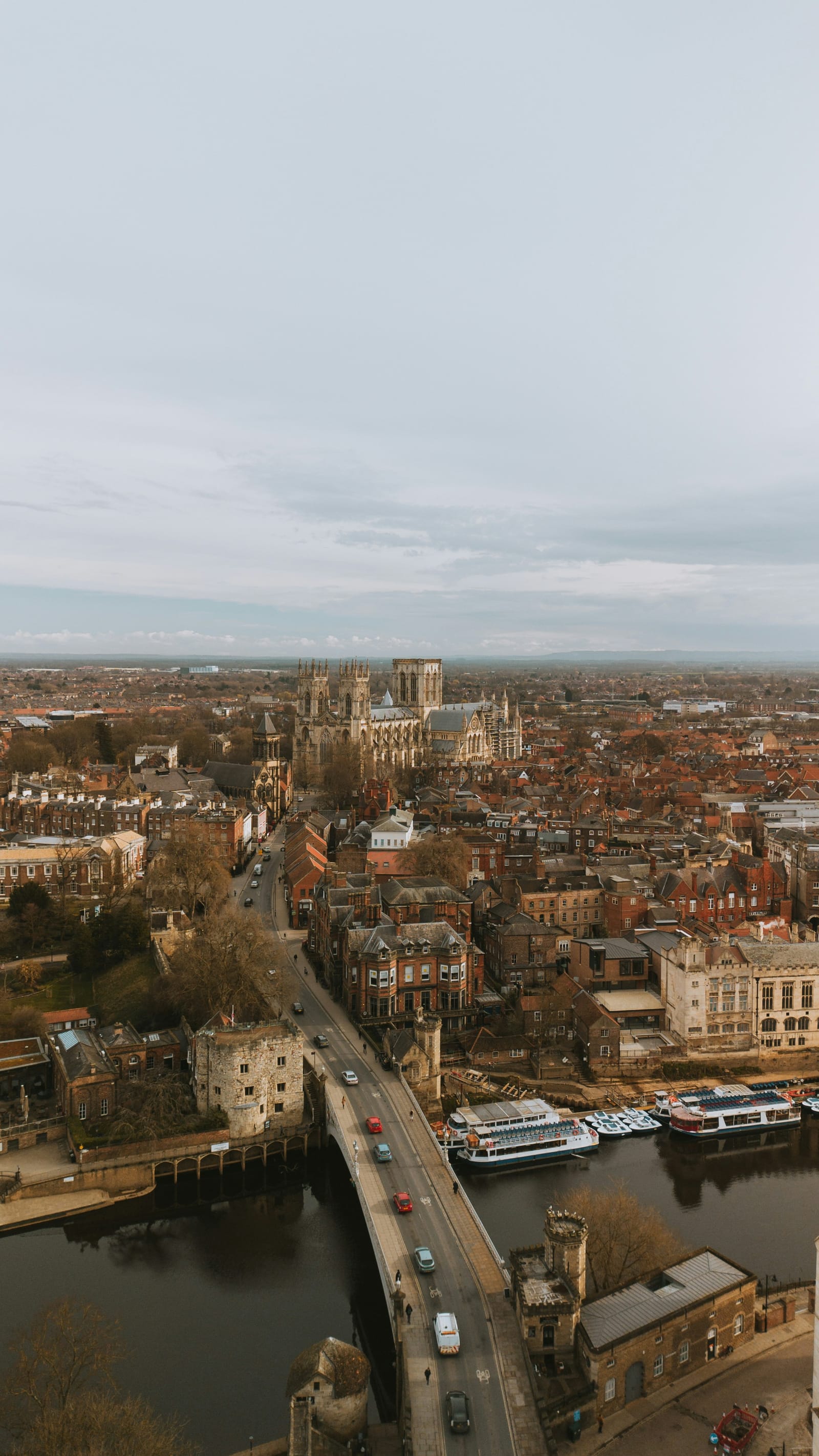 An aerial view over York, the Minster on the skyline and the Ouse curving through the city